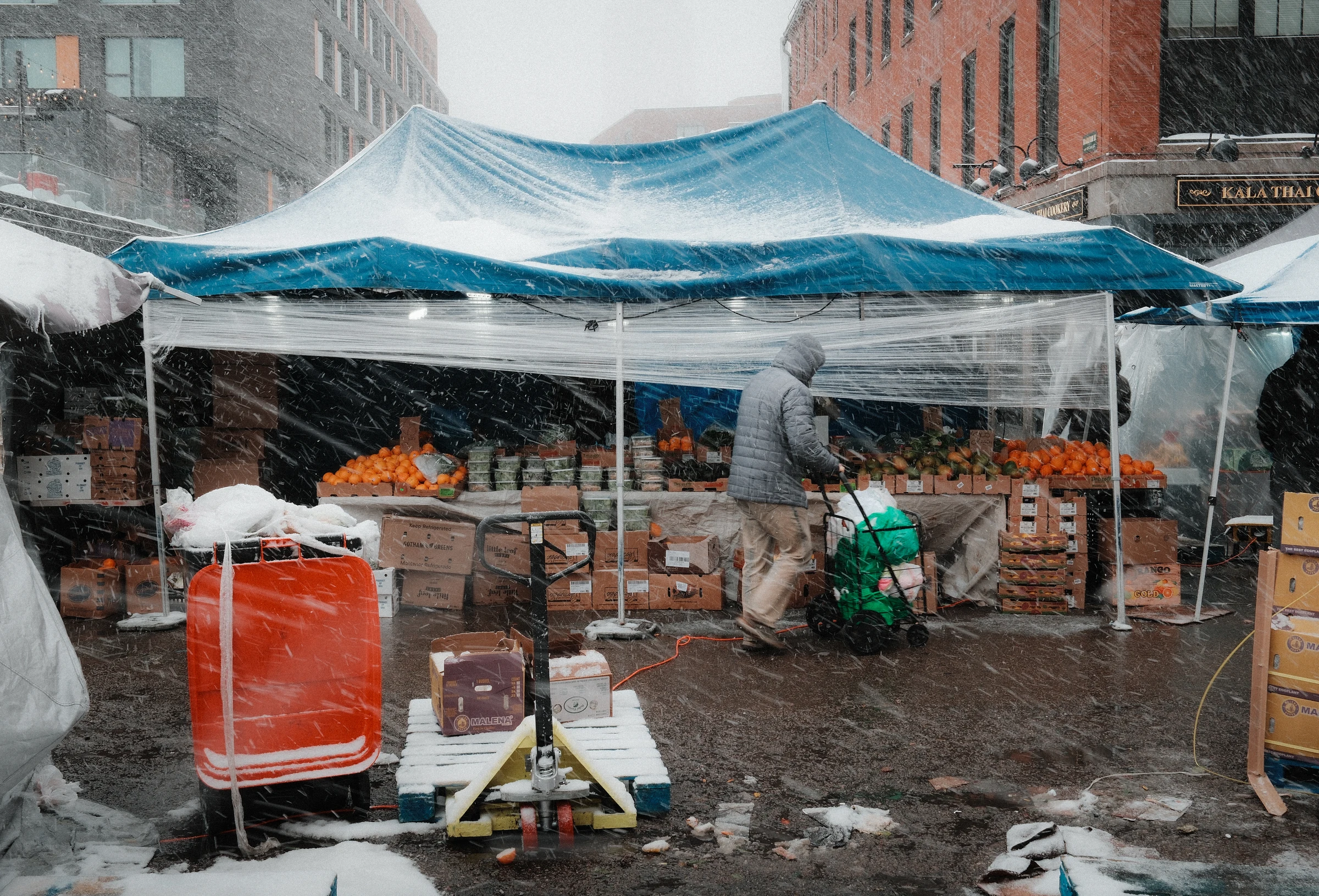 Shopper braving a storm at Haymarket