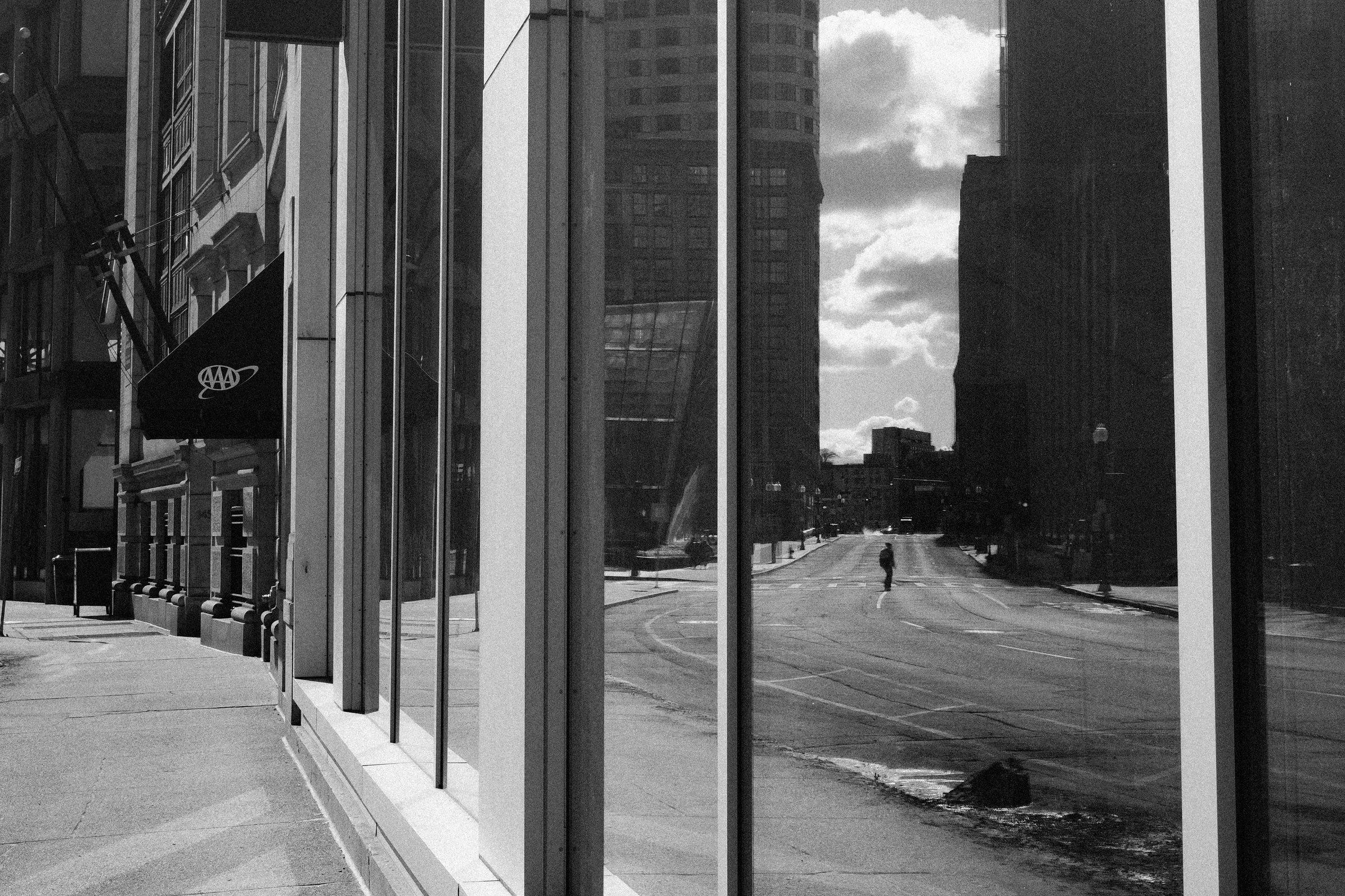 Person reflected on a street